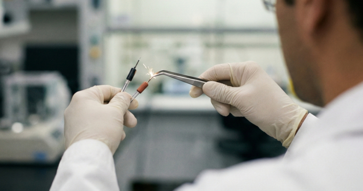Research staff in a laboratory conducting conductivity tests.
