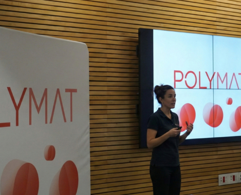 A person giving an explanation at Polymat