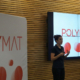 A person giving an explanation at Polymat